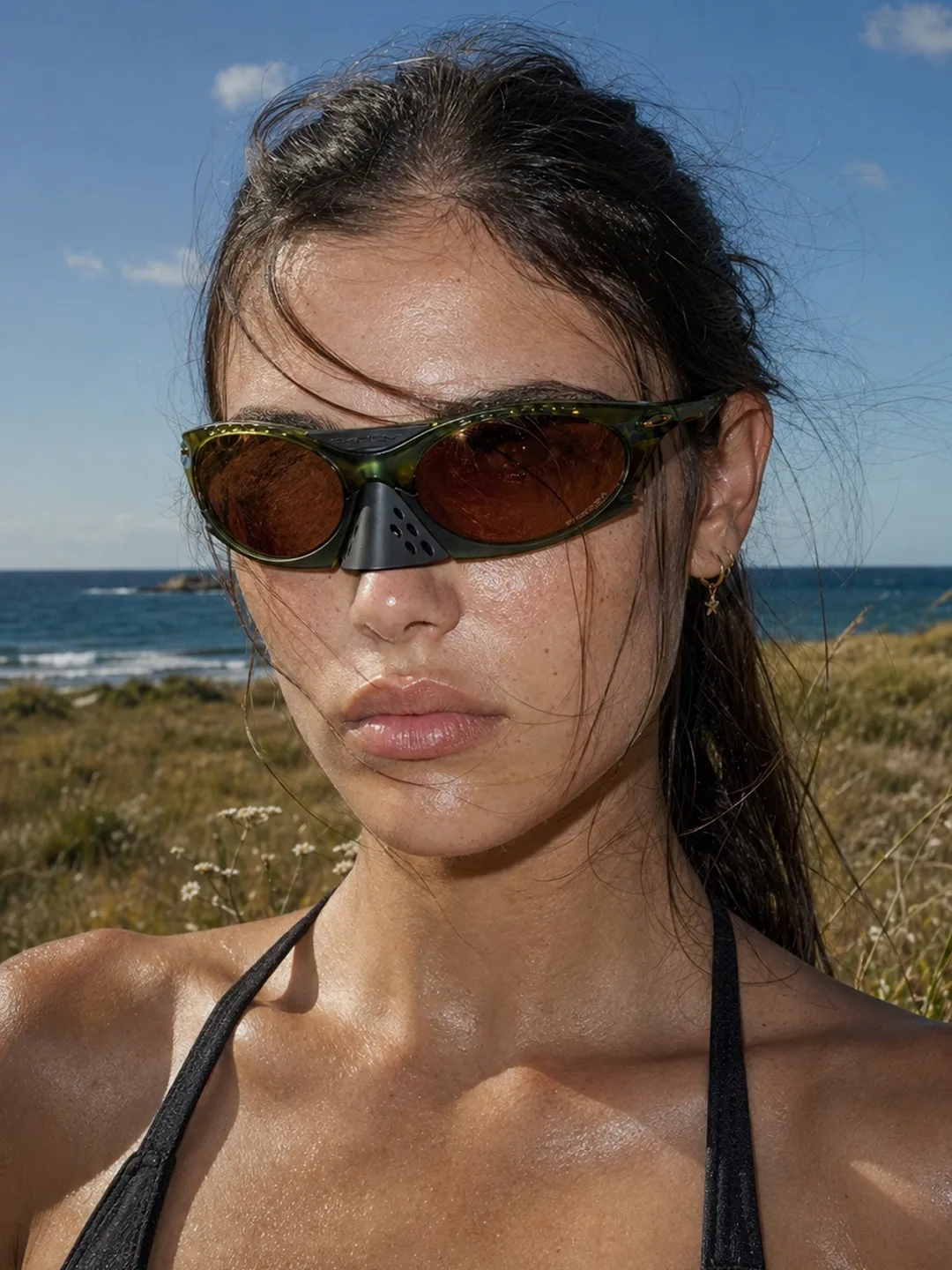 VAELT green eyewear among coastal grass dunes